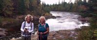 Picture of Autumn on the Superior Hiking Trail Women smiling by river on superior hiking trail
