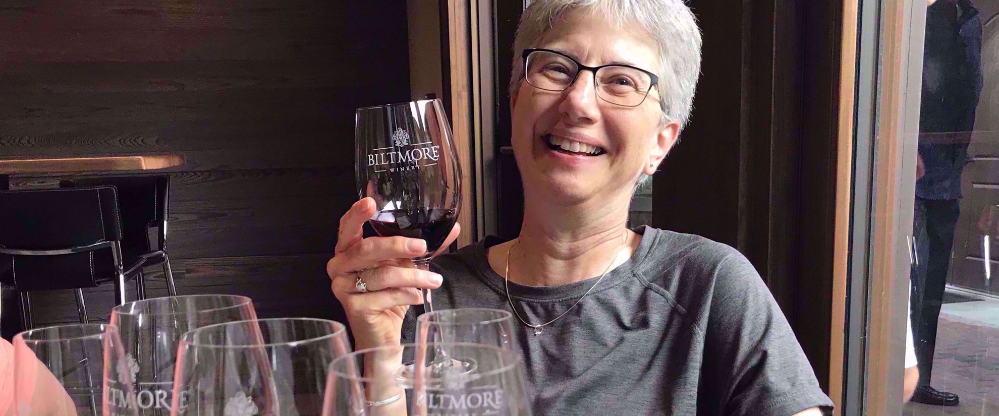 Picture of Blue Ridge Rambling Woman enjoying wine on travel tour through blue ridge