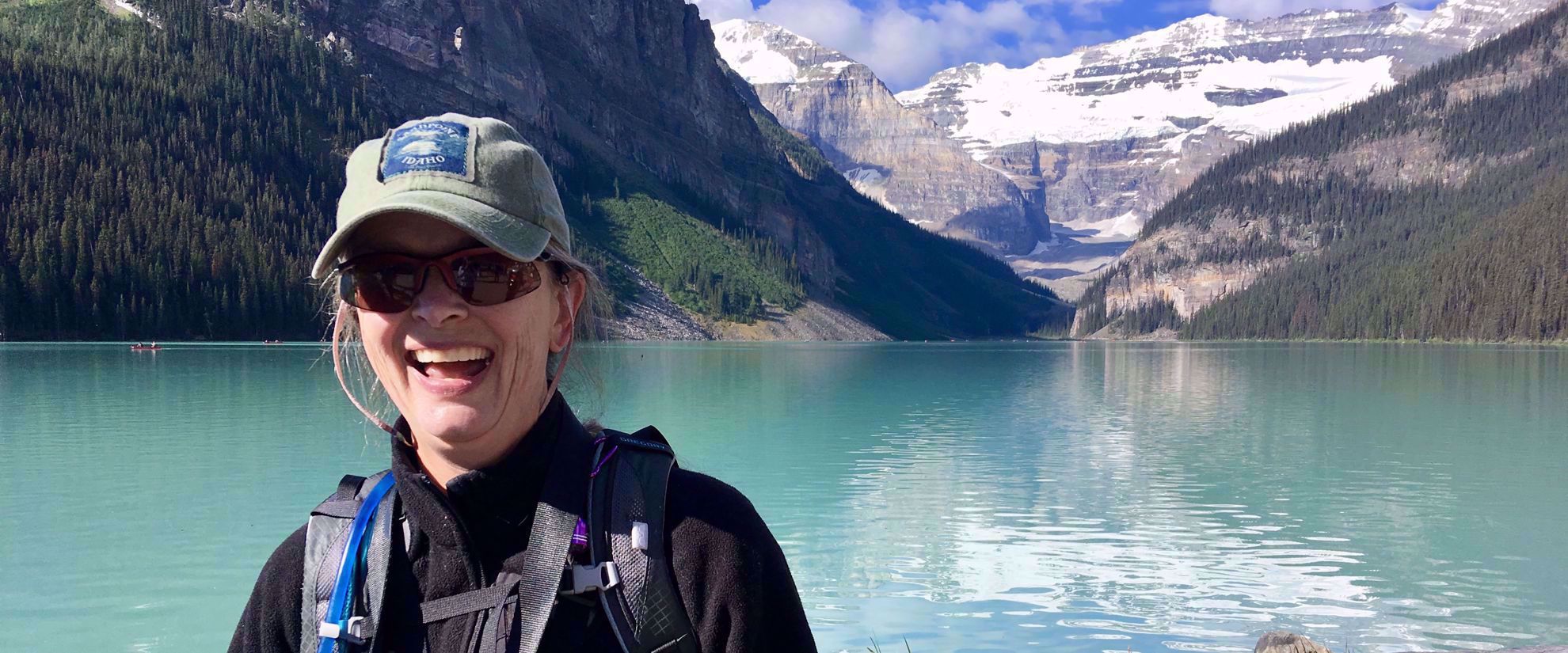 Woman smiling on group tour through canadian rockies