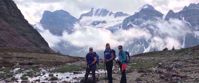 three women pose for photo during hike through canadian rockies