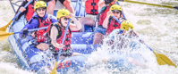 women rafting through colorado rockies
