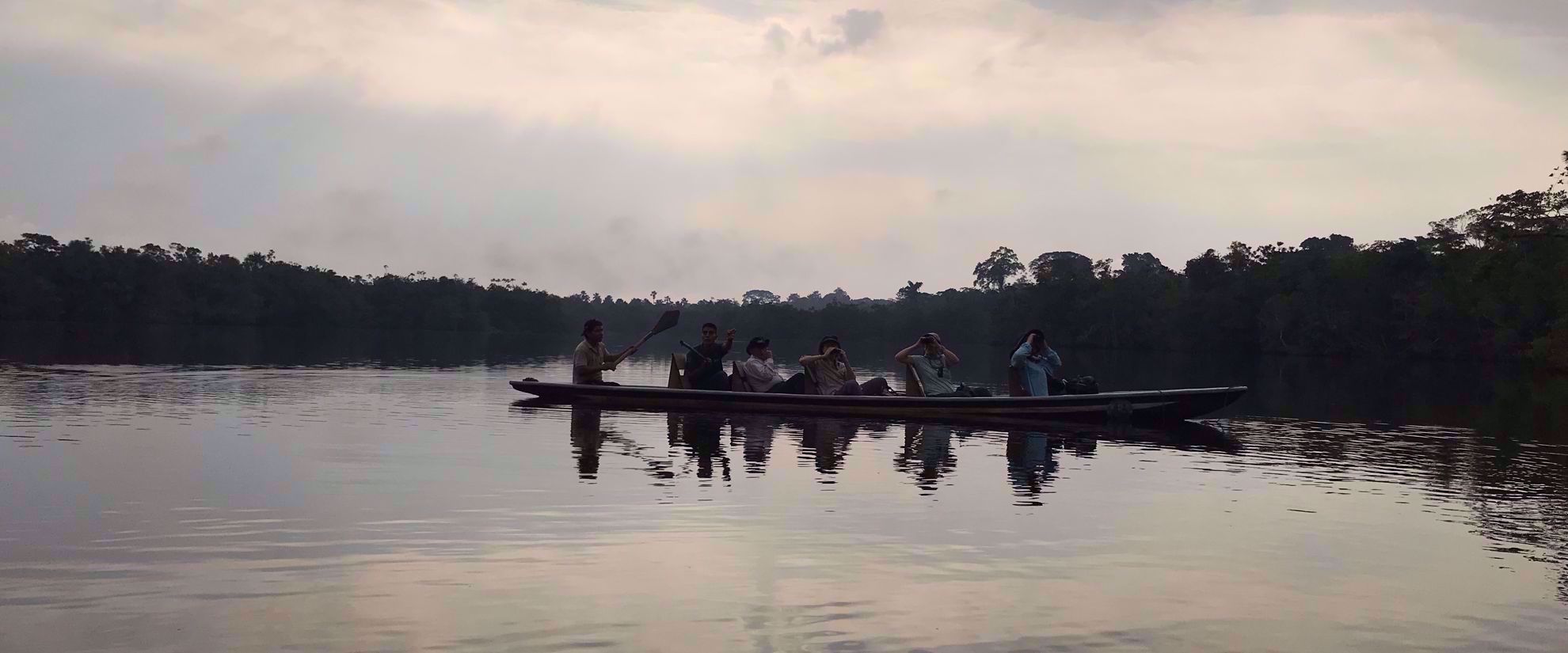 Picture of Ecuador's Amazon Jungle canoeing through amazon at sunset