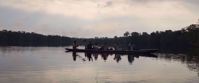 canoeing through amazon at sunset