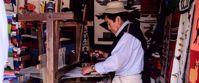 Picture of Exploring the Galapagos Islands by Land local man crafting goods on galapagos islands