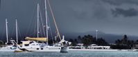 Picture of Exploring the Galapagos Islands by Land sailboats in harbor on cloudy day in galapagos
