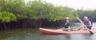 Picture of Exploring the Galapagos Islands by Land women kayaking on group travel tour through galapagos islands