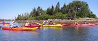 women kayaking in lake in nova scotia