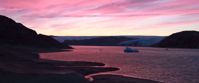 Picture of Hiking and Kayaking in Greenland pastel pink sunset over lake in greenland