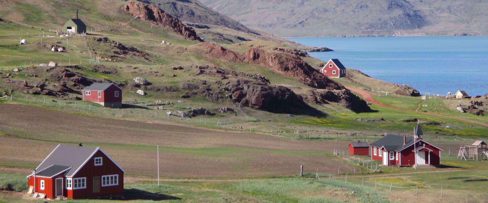 red houses on prairie in greenland