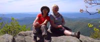 Picture of Hiking Lodge to Lodge on the Appalachian Trail two women sitting smiling on rock appalachian trail