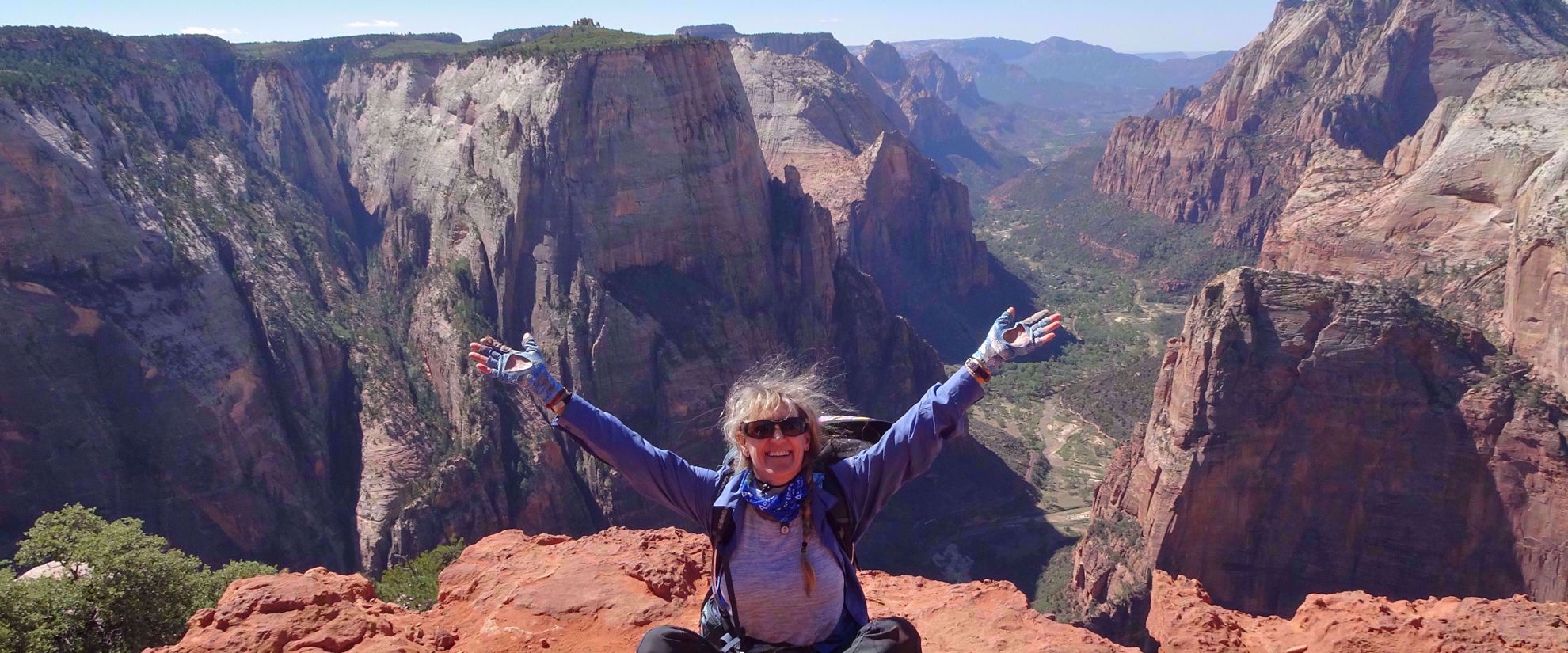 woman smiles after finishing hike in bryce national park