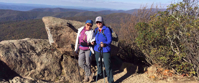 women on hike stop for photo appalachian trail