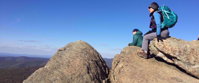 women admire view from rock on appalachian trail
