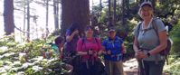 women laughing and smiling on group hike through olympic national park