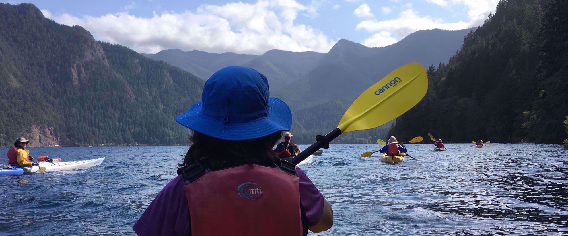 women's adventure travel group kayaking through olympic national park