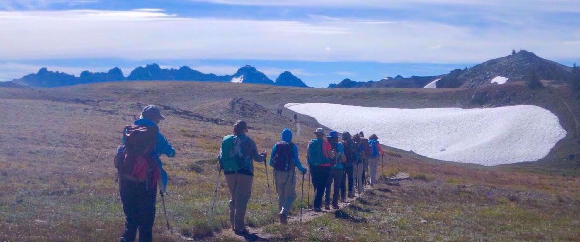Picture of Pacific Northwest Escape: The San Juan Islands & Olympic National Park women hiking through snowy mountains olympic national park