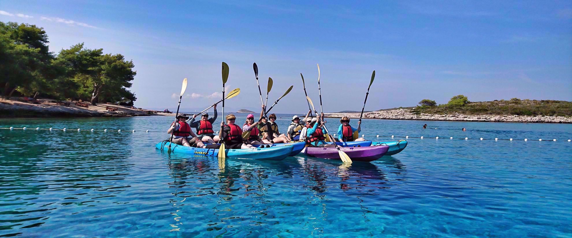 Picture of Pearls of the Croatian Coast women kayaking in bright blue water croatia