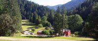 Picture of Rafting and Hiking the Rogue River red house with white trim in rural oregon