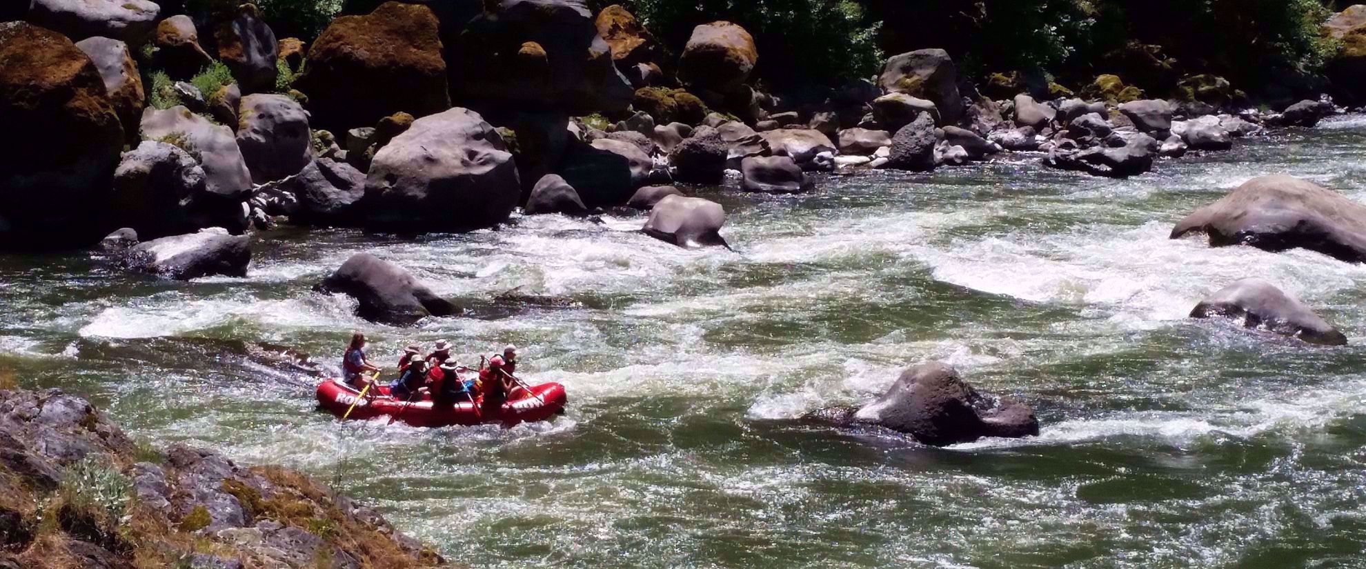 Picture of Rafting and Hiking the Rogue River rafting through rogue river rapids with rocks