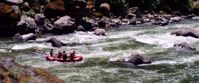 Picture of Rafting and Hiking the Rogue River rafting through rogue river rapids with rocks