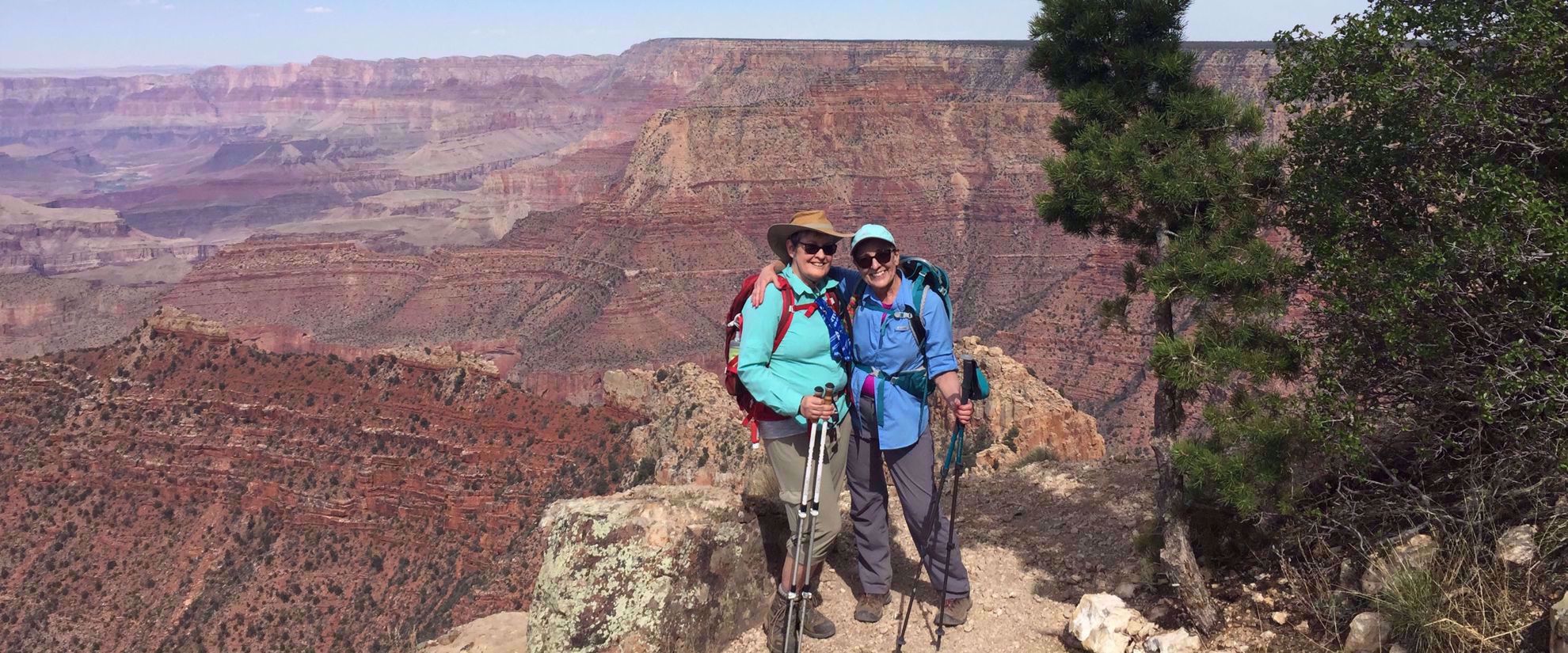 women pose for photo during hike through grand canyon