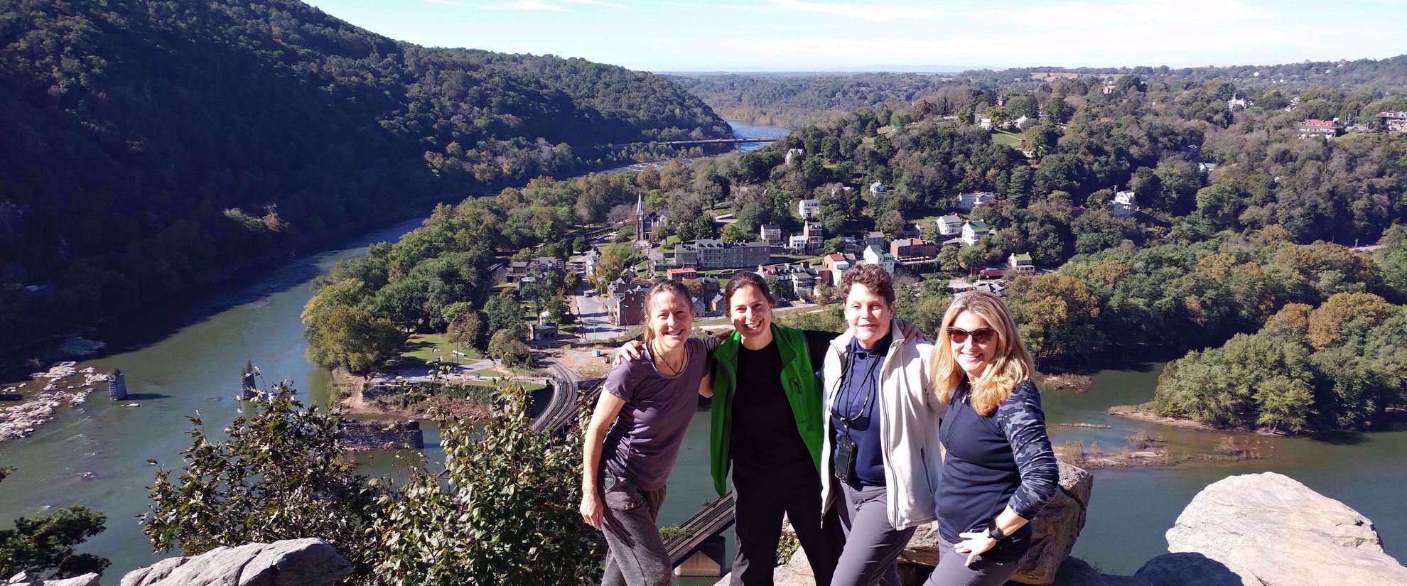 Picture of Slackpacking Harpers Ferry four women smiling at lookout point in harpers ferry