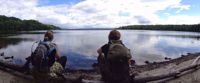 Picture of Slackpacking Maine women relax by water while hiking through maine