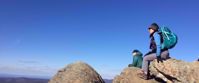 Picture of Slackpacking Virginia women sitting on rock enjoying view virginia