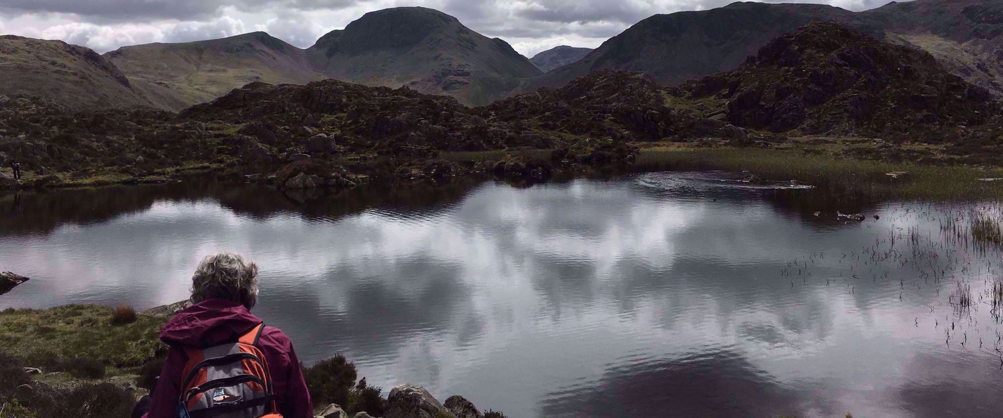 Picture of Tramping the Lake District woman taking a break on hike through Grasmere uk