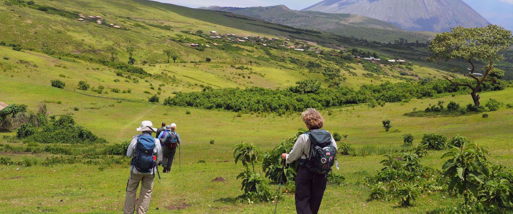 women hiking through beautiful green tanzania