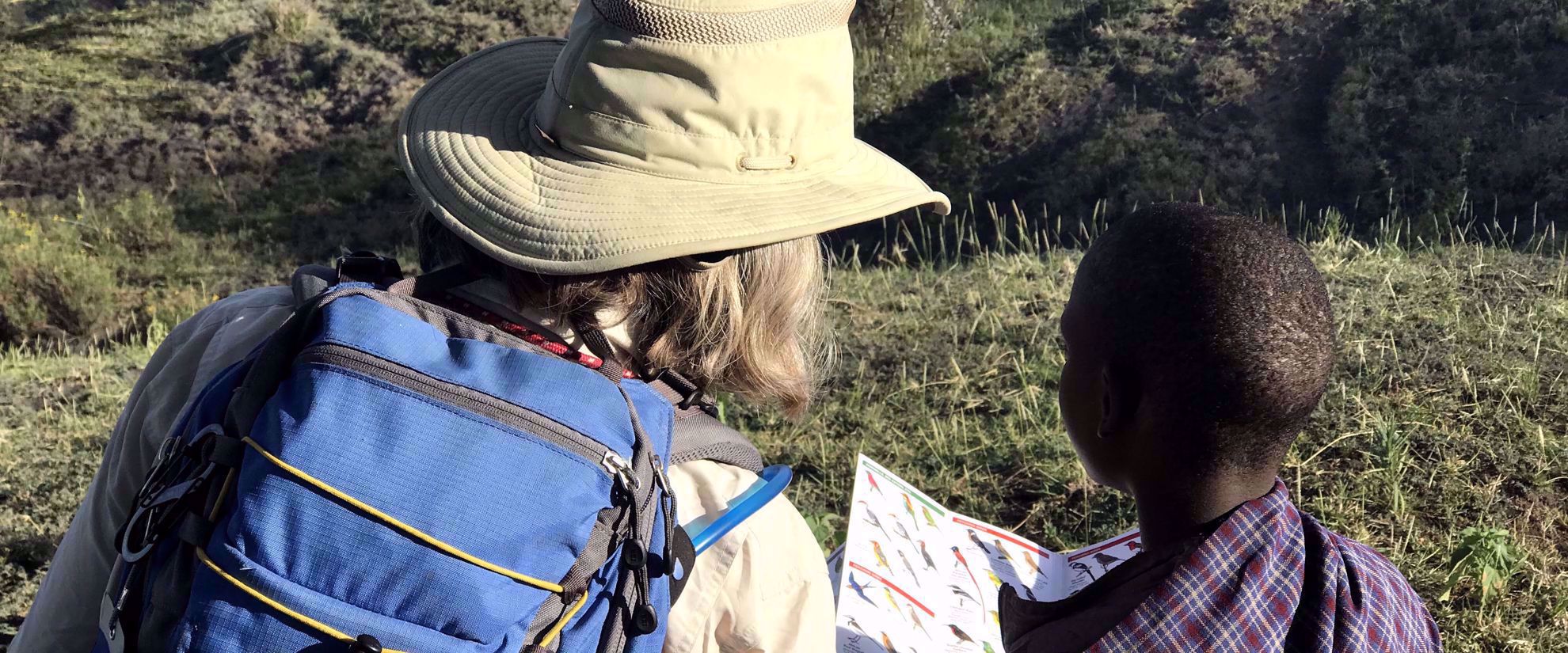 woman on group travel tour with tanzanian local
