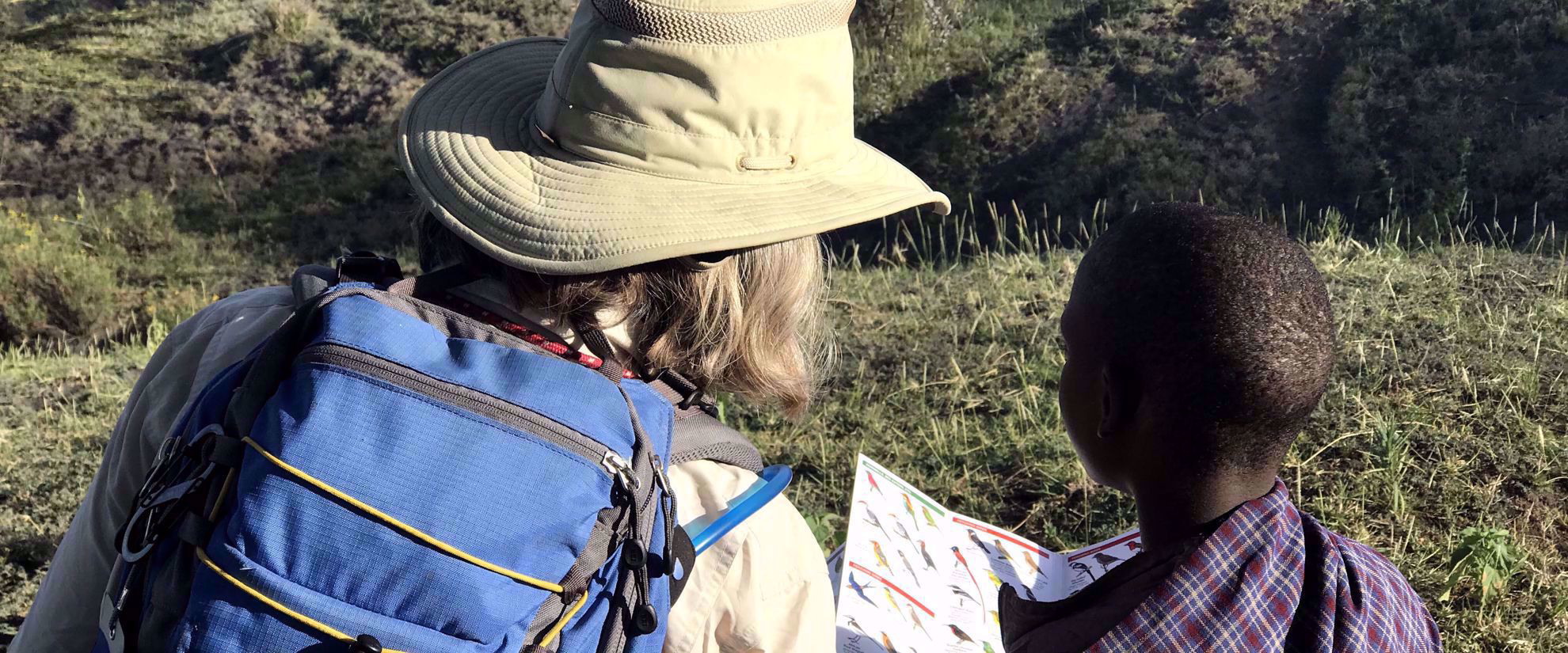 woman on group travel tour with tanzanian local