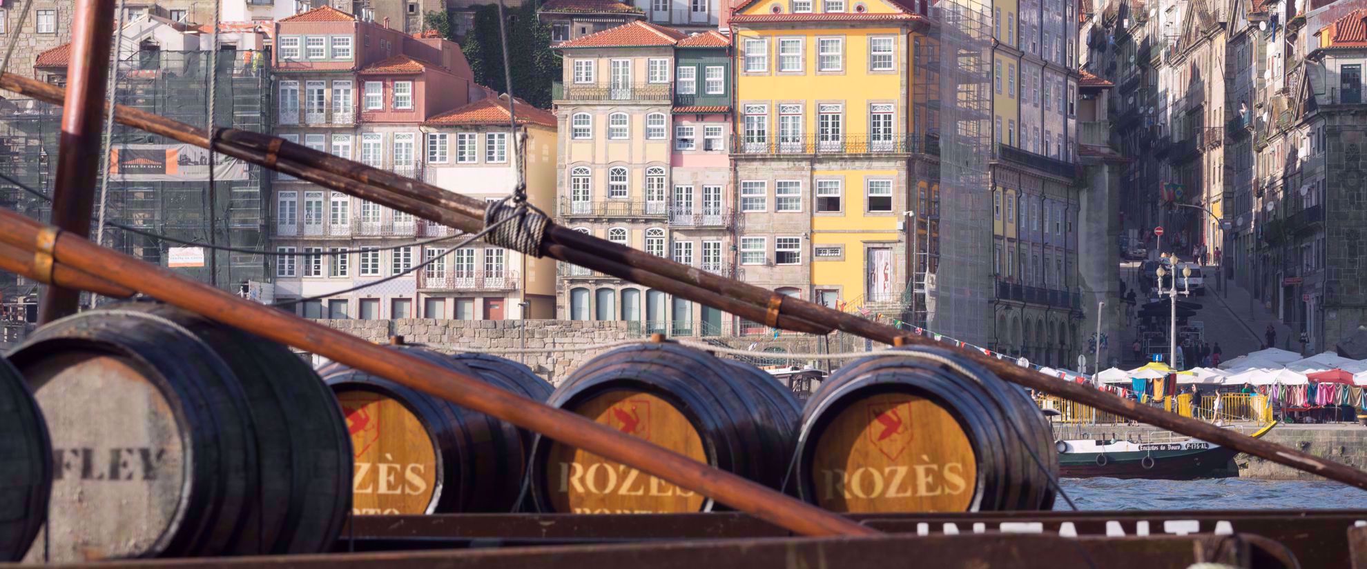 wine barrels on sailboat in douro valley