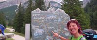 Picture of Hiking Italy's Northern Alps woman points to cal de locia cancello sign northern italian alps