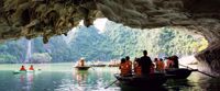 kayaking through caves on women's tour through vietnam