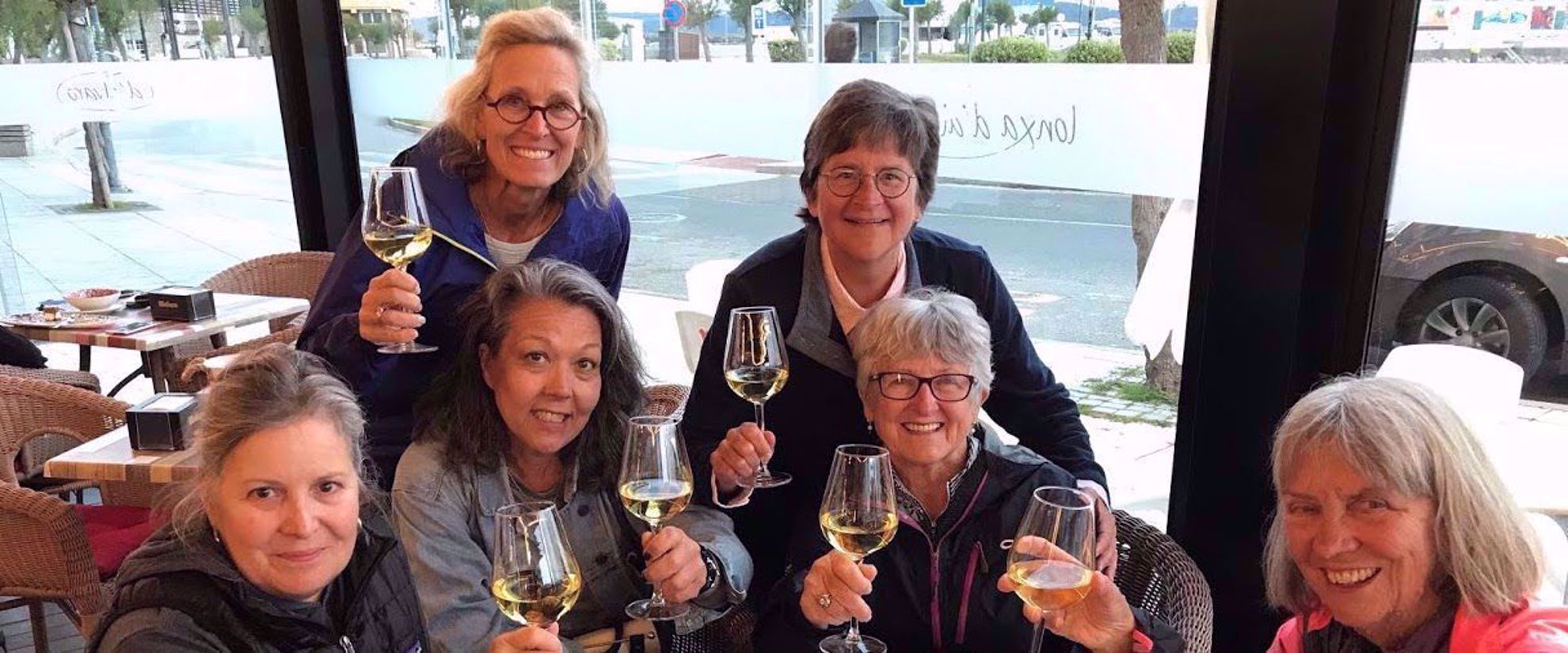 Women toasting with wine on group travel tour to spain