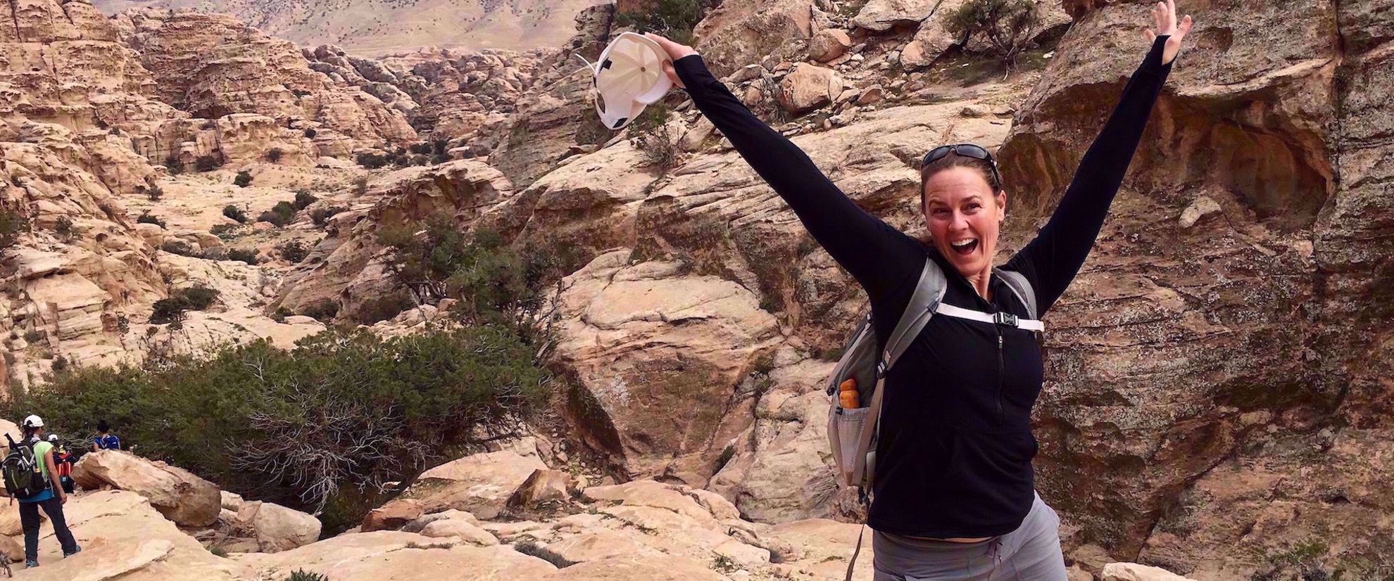 woman smiling on group travel adventure through jordan