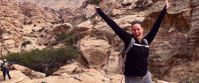 Jordan Keeps Surprising woman smiling on group travel adventure through jordan