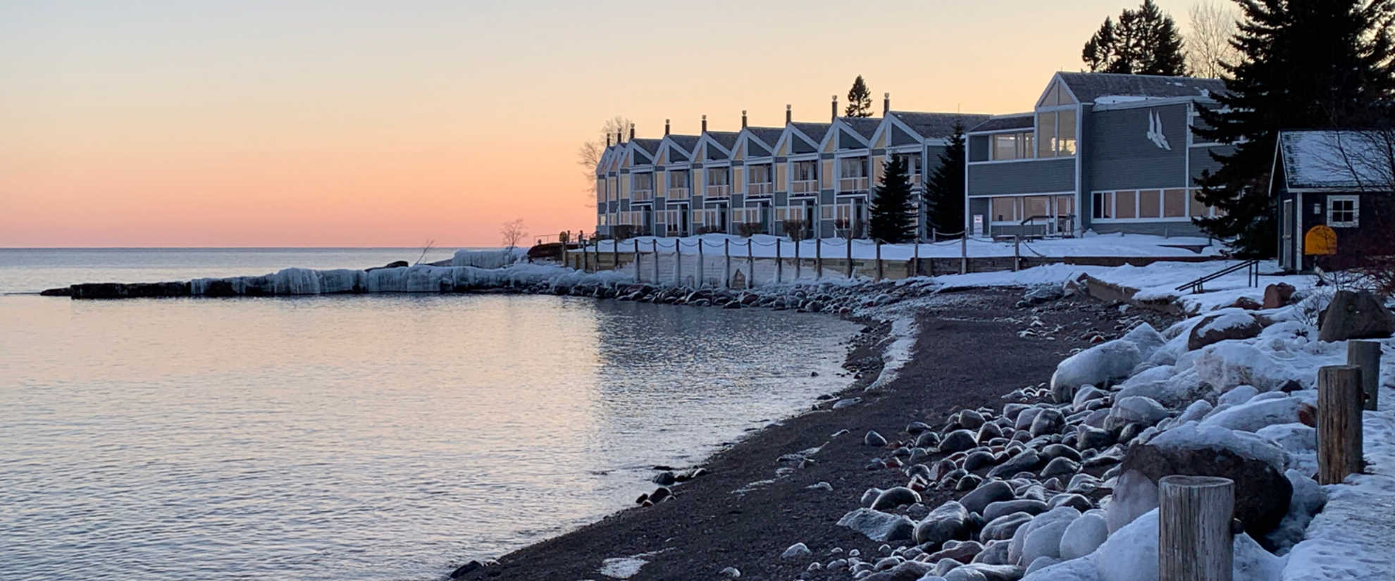 pastel sunset behind lodge in tofte Minnesota