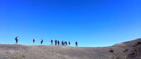 Picture of Death Valley Delights women on a hike on a ridge desert photo. bright blue sky in background