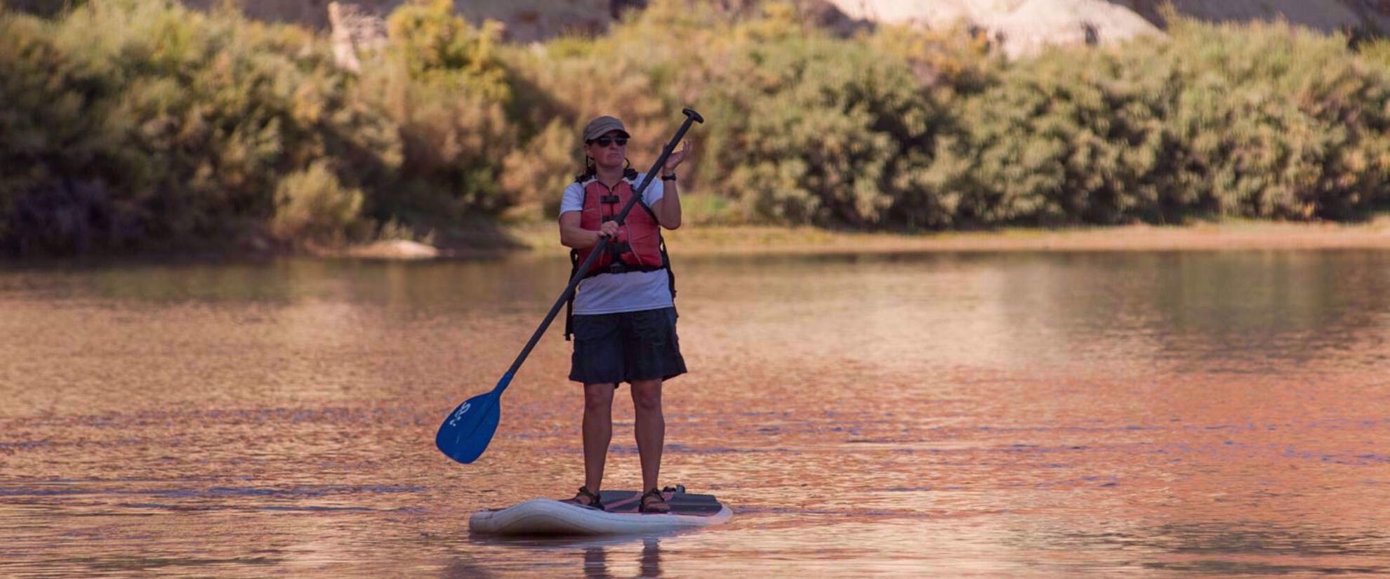 SUP Woman stand up paddling Colorado River