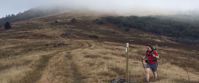 Picture of Slackpacking Virginia women hiking though misty meadow in virginia