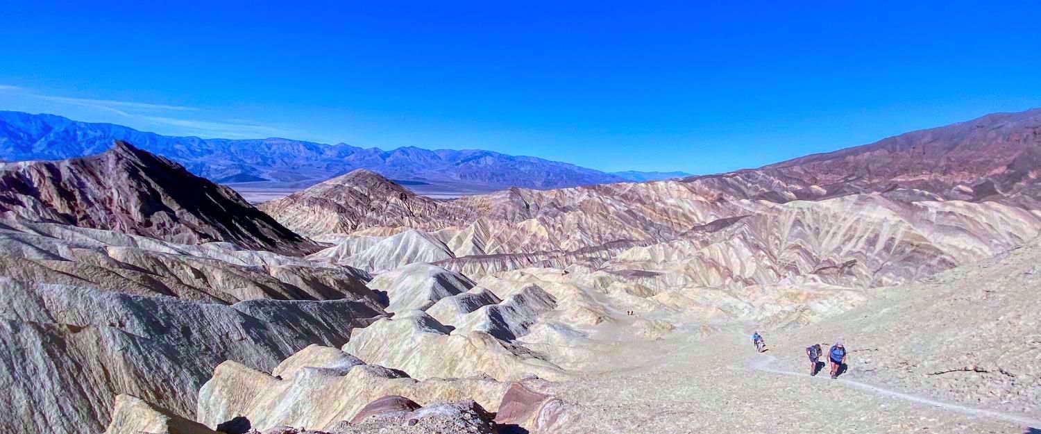 hiking the vastness of the desert in death valley