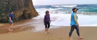 barefoot walking along the beach in portugal