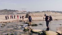 Portugal Beach Womens Hiking across Water Portugal Beach Womens Hiking across Water